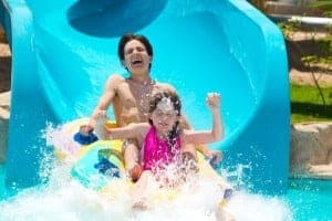family enjoying a water slide at Dollywood's Splash Country