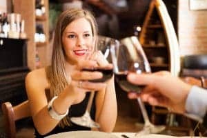 Sharing a glass of wine at a nice restaurant is one of the best romantic Gatlinburg vacation ideas.