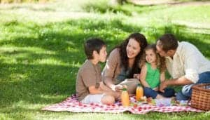 Family enjoying a picnic.