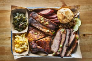 barbeque platter with brisket, ribs, chicken, and more